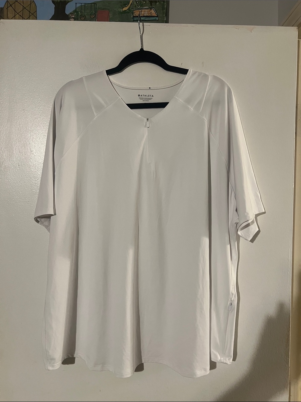 Athleta white collarless quarter zip short sleeve top. Side zip pocket